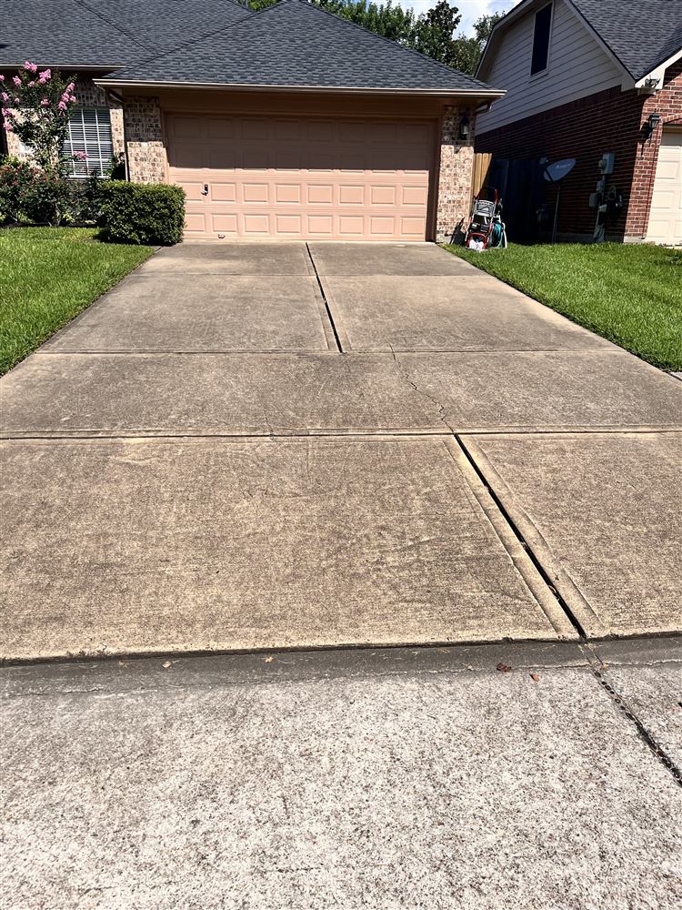 Driveway before pressure washing